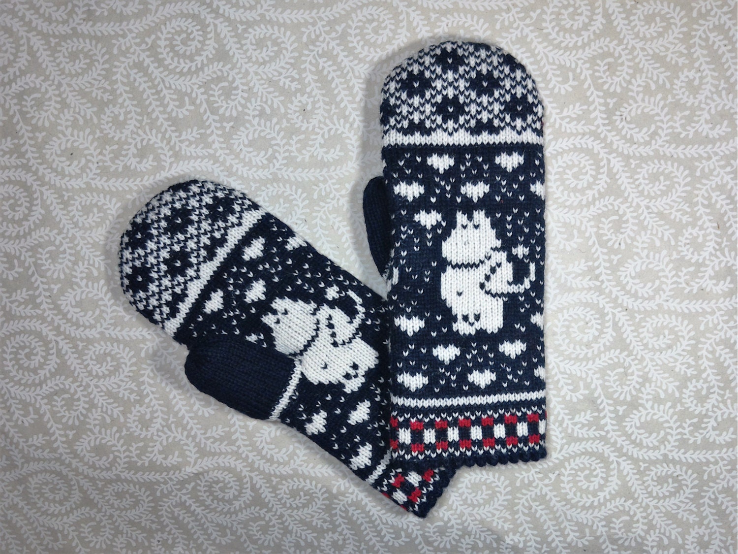 Hand-made adult mittens with moomin pattern