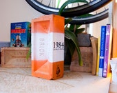 Painted Brick Book 1984 on Orange and White Brick