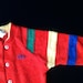 Izod Lacoste footed pajama 1980’s, red with yellow, blue and green trim, infant size small, gently used