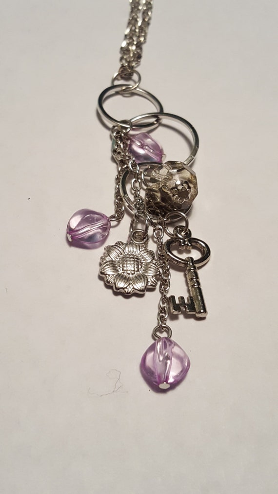 Long purple accented necklace multiple charms by Gigisof518