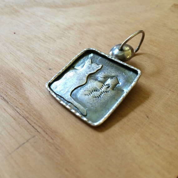 Cat longing for home sterling silver pendant