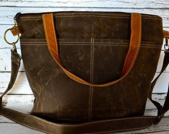 green and black diaper bag