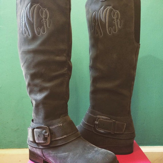 monogram plaque long leather boots