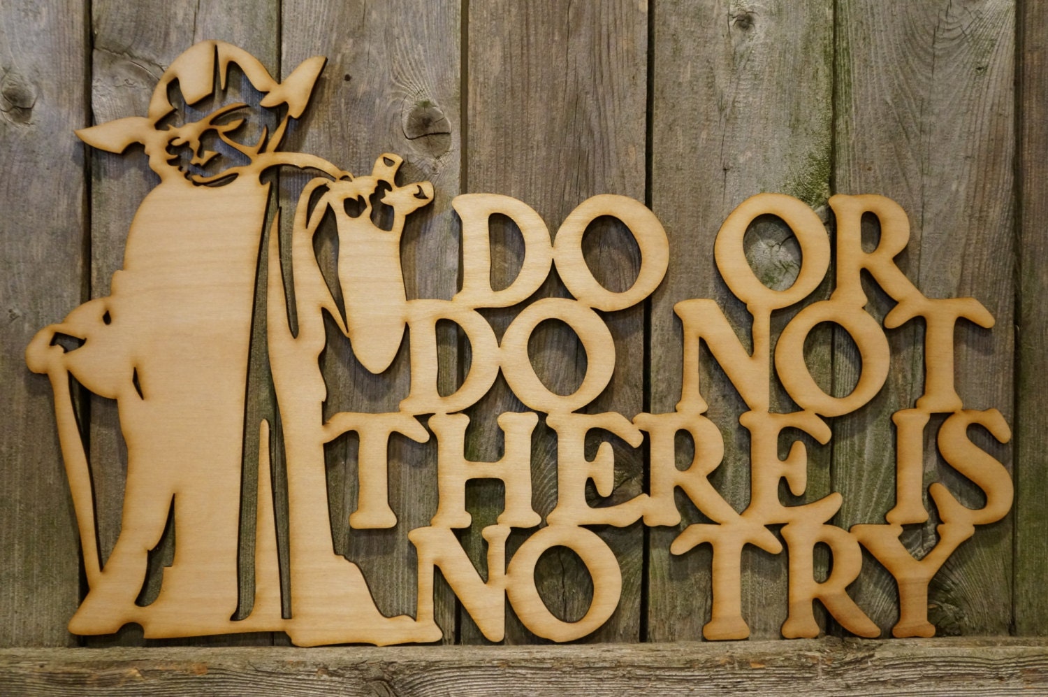 Yoda do or do not there is no try wood cut sign