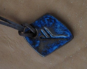 Pendant with rune of Fehu. Amulet of wealth and luck