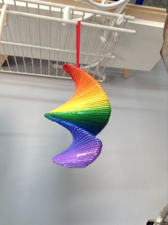 Hand made popsicle stick wind spinner. Hand painted mobile.