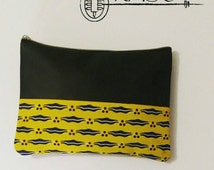 black and yellow clutch bag