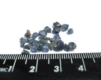 Sapphire crystals. 22-26 plus or minus pieces of natural untreated Australian Sapphire. 10 carats plus per lot.