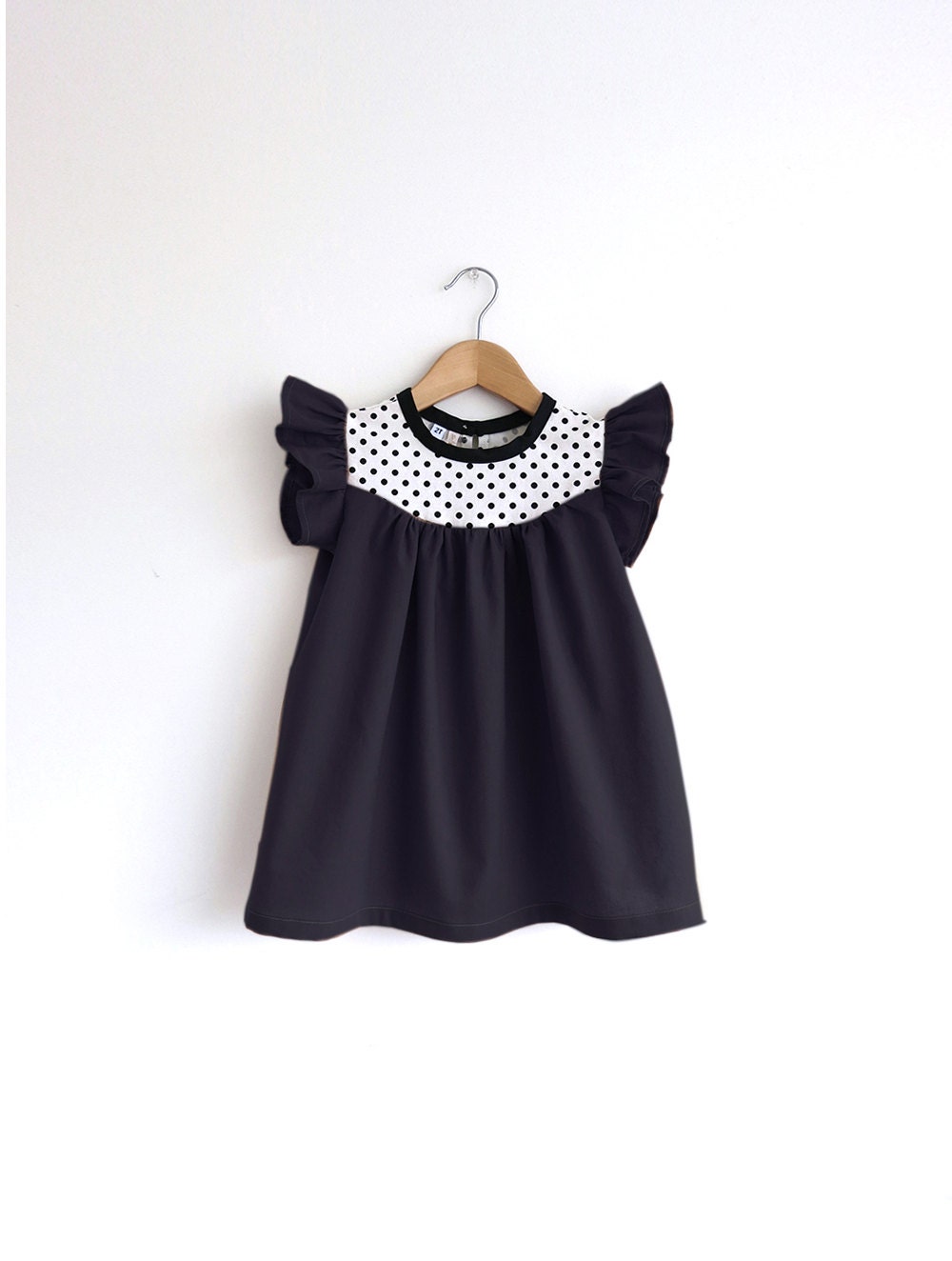 size 4/5T only: girls black cotton dress with dots detail