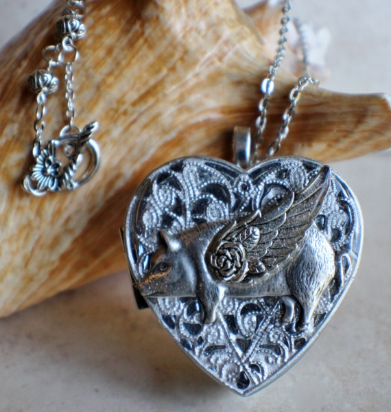 Pig with wings, heart music box locket, heart locket with music box inside, in silver tone with a winged pig. by Charsfavoritethings steampunk buy now online