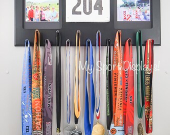Black Sport Medal display with clamp bib holder and photo frames. Black mat.