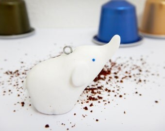 White elephant with trunk upraised