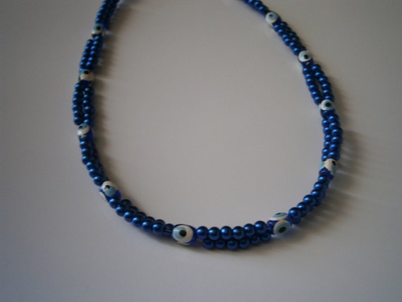 Beaded Necklace: Blue "Evil Eye" Double Standed Beaded Necklace.