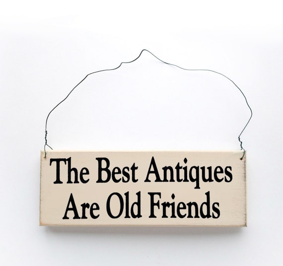 Wood sign saying The Best Antiques Are Old Friends