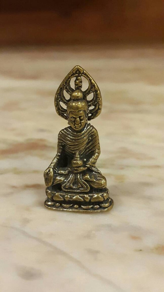 miniature sculpture of buddha