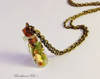 Gold leaf and moss in glass bottle 24k