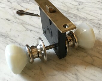 Beautiful milk glass handle set with working mortise lock and key.