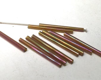 10 iridescent glass tube beads in green, purple, blue, and yellows