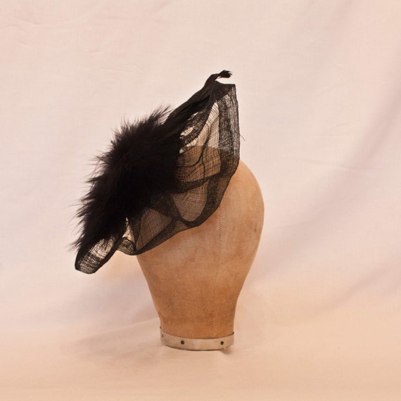 Handmade black ladies side hat decorated with marabou, feathers and jewel detailing