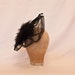 Handmade black ladies side hat decorated with marabou, feathers and jewel detailing