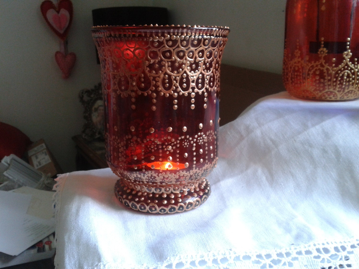 Chunky red glass candle holder hand decorated with copper
