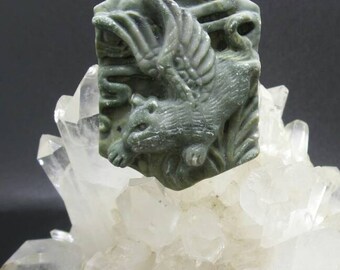Carved Ribbon Jasper Flying Cat Pendant.