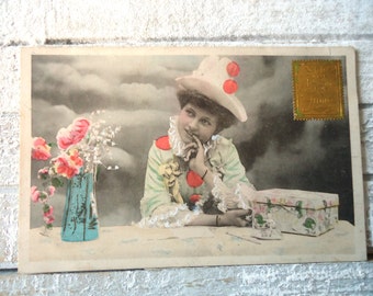 Antique Colombine postcard - Woman clown costume, hat pompons, table box vase flowers, Pierrette Edwardian, gold stamp, french tinted 1900