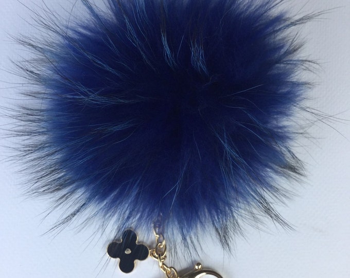 Deep blue with natural markings Raccoon Fur Pom Pom luxury bag pendant + black flower clover charm keychain