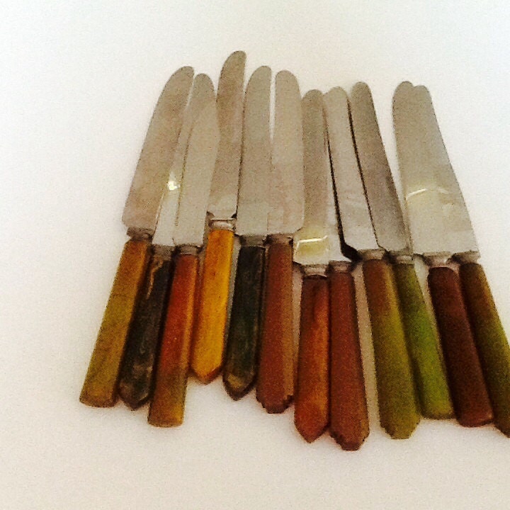 Assortment of vintage Bakelite flatware in green. Mid century