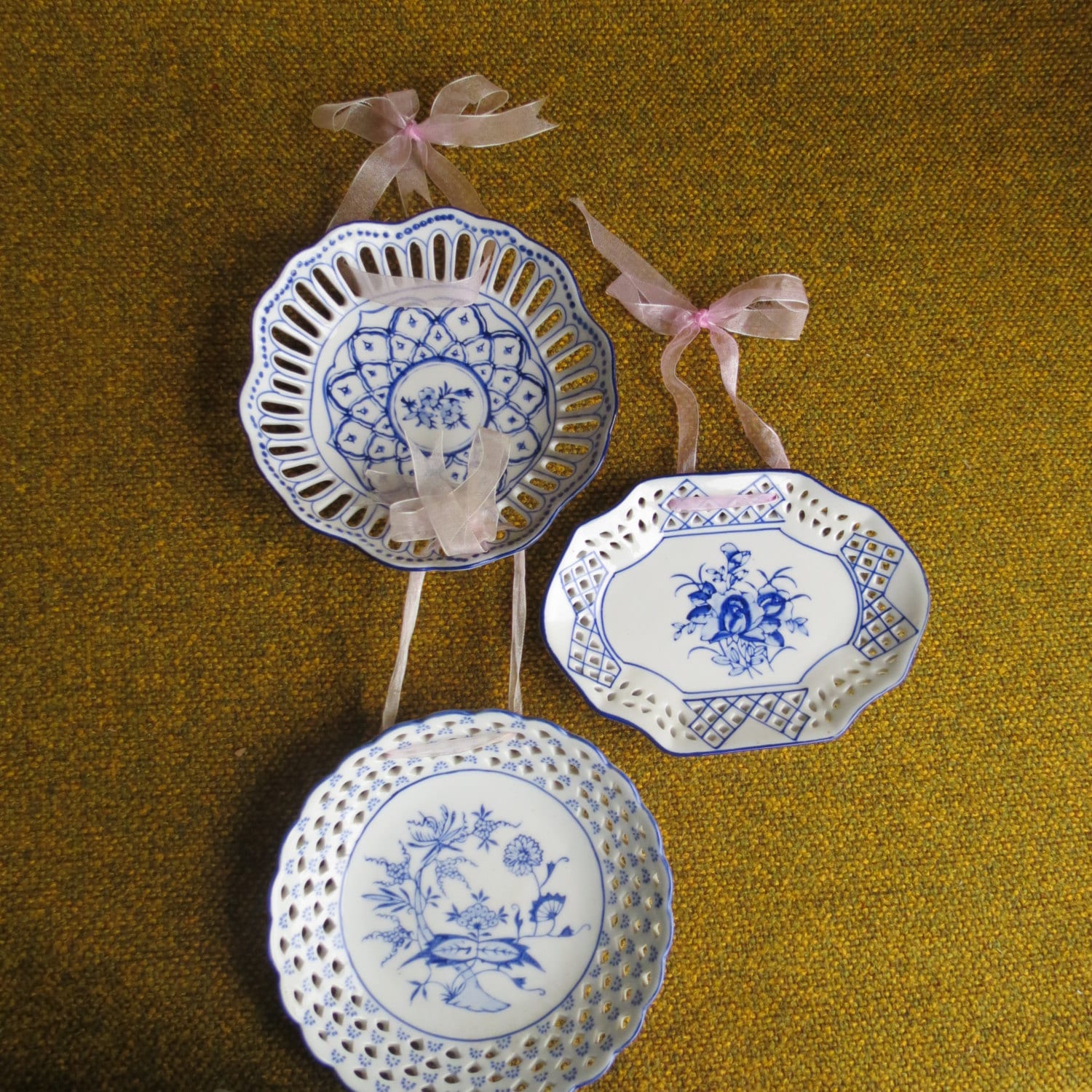 Delicate blue and white decorative hanging plates. Lacy