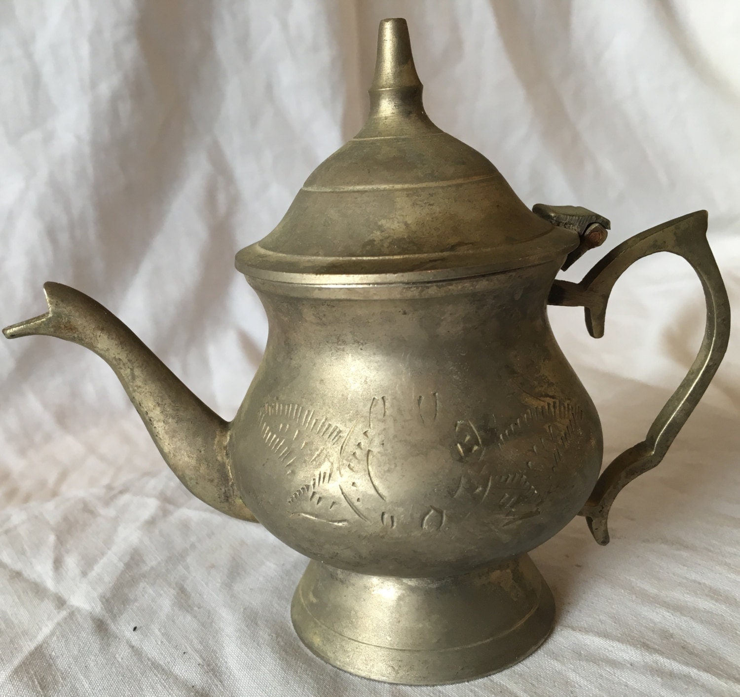 Antique Indian teapot from copper with handmade flowers carved