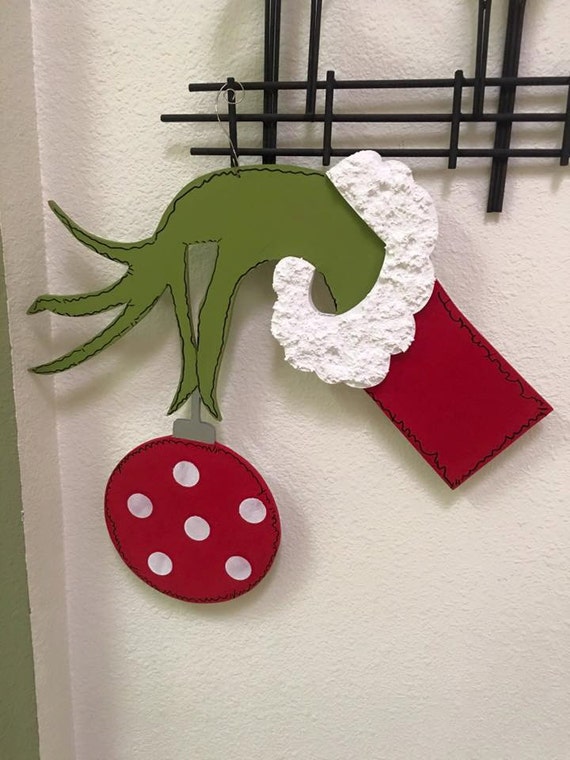 Grinch hand holding ornament by Gourdsandgifts on Etsy