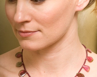 Delicate Watermelon Peridot slices with purple garnets.