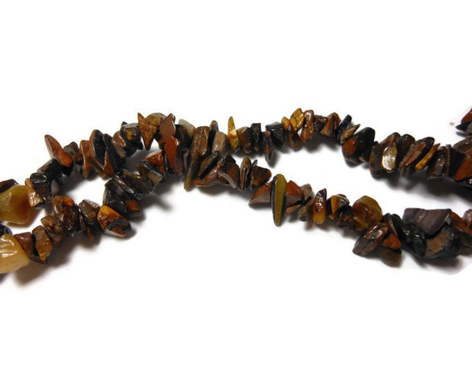 Tiger's eye necklace, medium chip beads, natural semi-precious gemstone, 35 inch strand, chips from small to extra-large, average medium