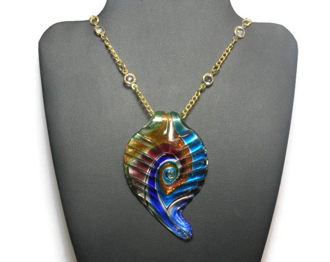 Lampwork crystal necklace, large lampwork leaf in swirling blues, greens and gold sparkle foil on a gold plated chain with clear crystals.