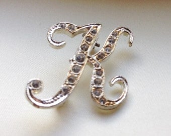 Initial K pin with rhinestones.