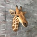 stuffed giraffe head wall mount