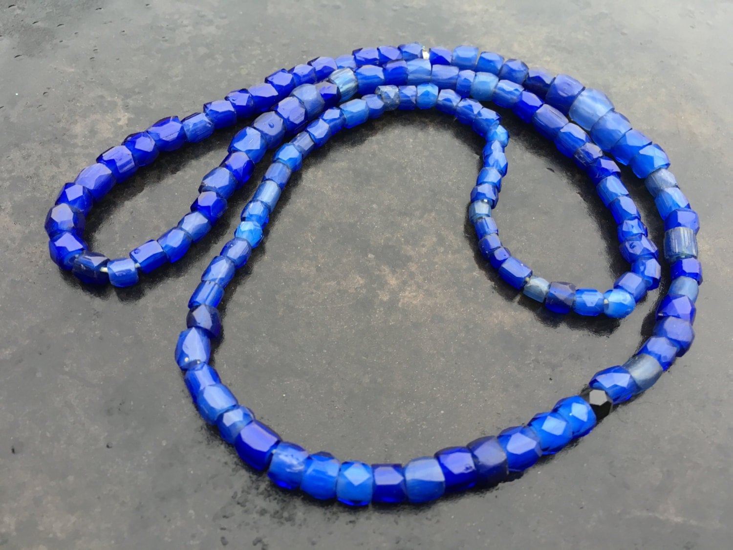 Russian Blue trade beads. Brilliant blue faceted strand.