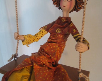 fairy on a swing figurine