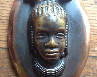 Nice metal pendant, woman's head probably Mangbetu