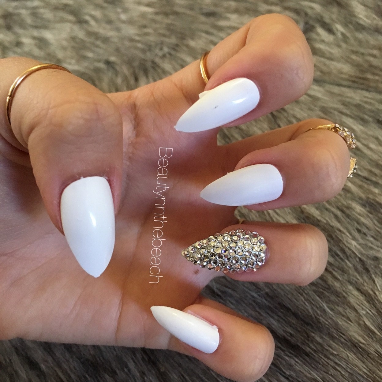 Stiletto nails with rhinestones nude white by BeautyNdTheBeach