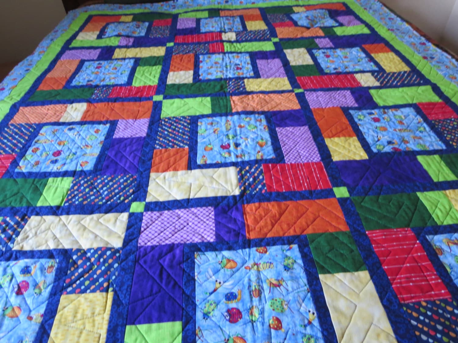 Bugs Laptop quilt with flannel back. Primary colors and a