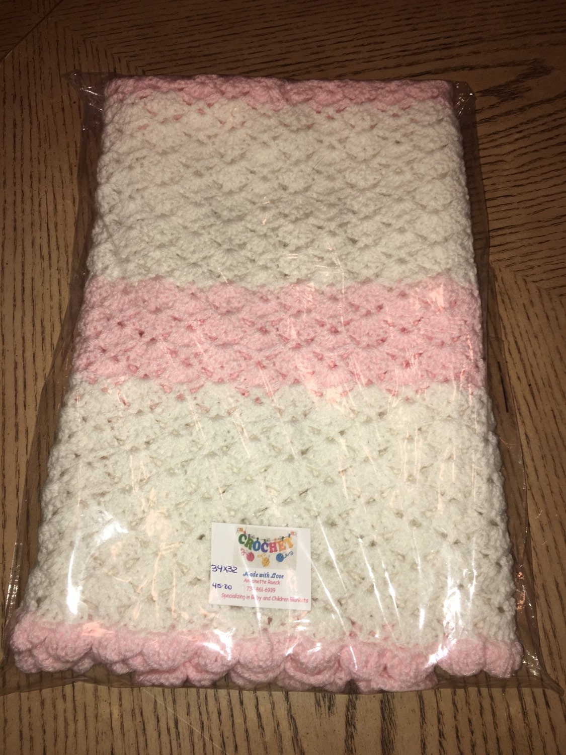 White and Pink Crocheted Baby Blanket