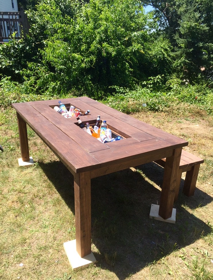 Patio table with built in coolers and matching benches