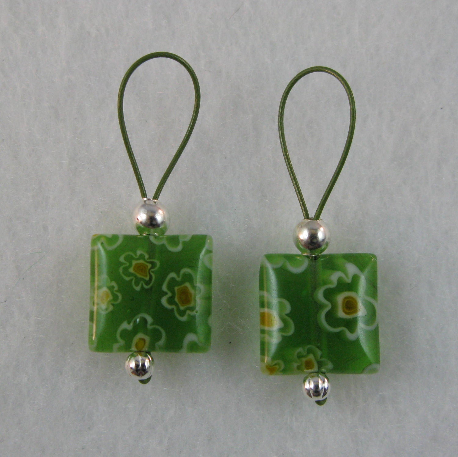 Green Glass Millefiori Stitch Markers on Khaki Colored Wire
