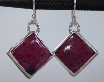 Pink Rhodonite gemstone set in silver earrings