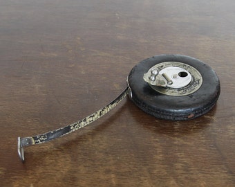 Very Old Leather Covered Metal Tape Measure