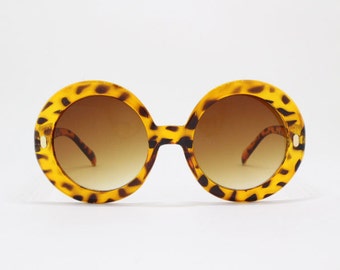 60s style sunglasses, round oversized glasses, tortoise frame, black lens, women's eyewear