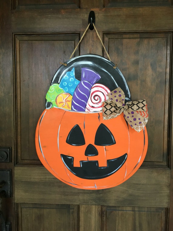 Items similar to Pumpkin candy pail Door Hanger for Halloween Wood Hand