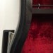 Violin case shelf 1. Recycled hardshell violin case with